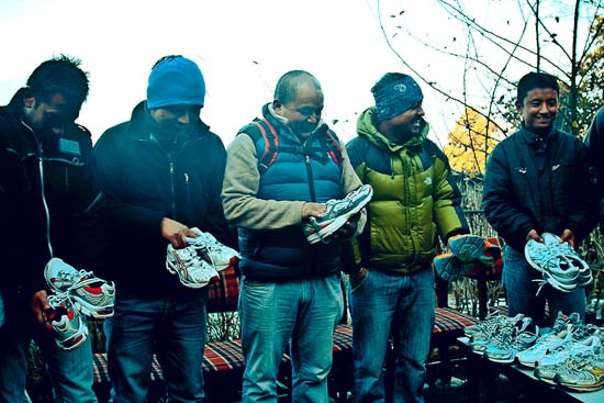 Himalayan porters receiving their shoes