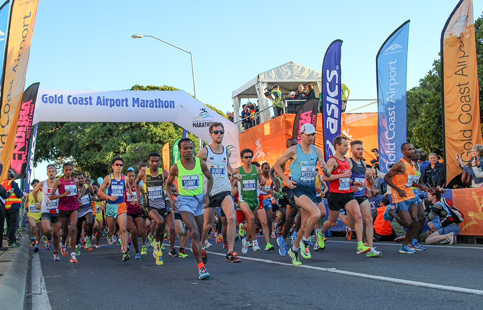 42km Elite athletes zooming pass just seconds after the flag off.