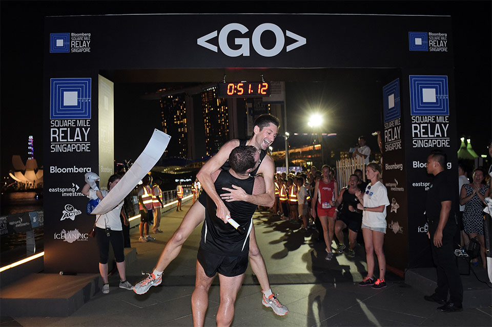 Team Macquarie celebrate their win of the Bloomberg Square Mile Relay Singapore 2014.