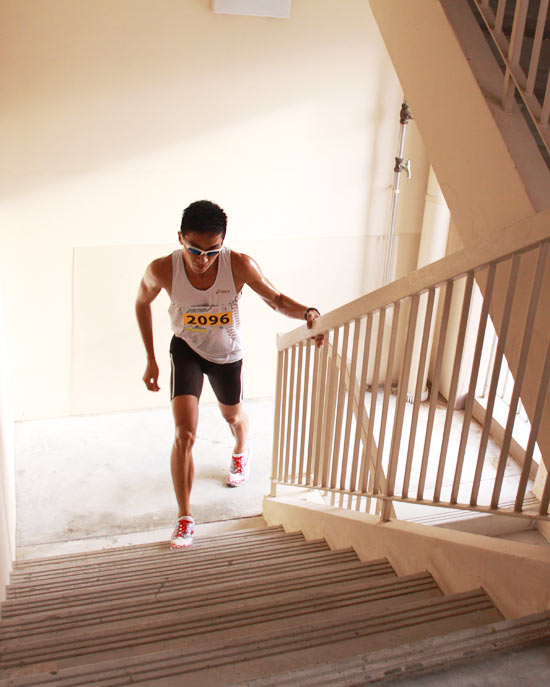The Men's Open champion races up the last flight of stairs