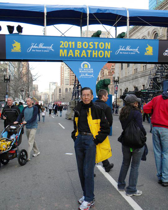 Kor posing at the Boston Marathon race site