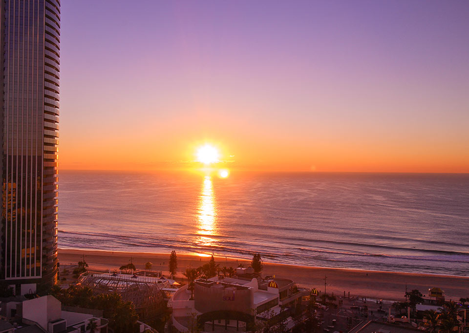 Staying at the upper floors of Grand Chancellor Hotel gives you spectacular views of the Gold Coast sunrise.