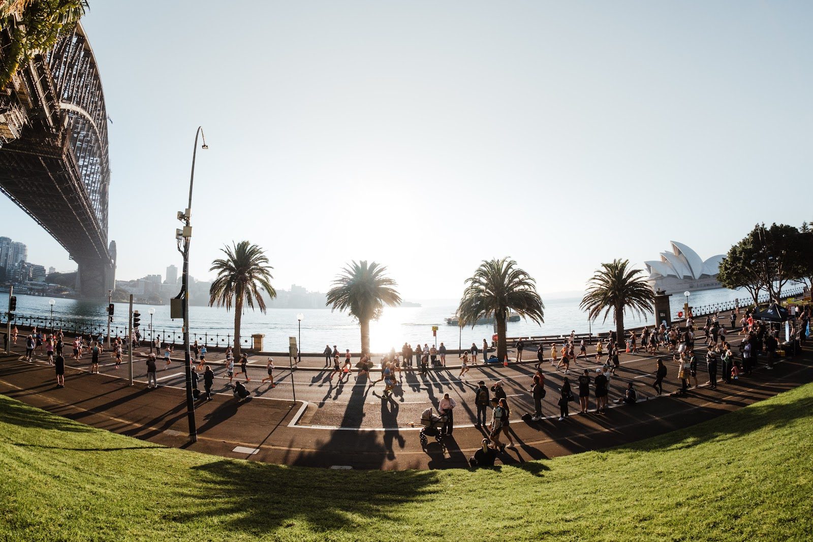 Runners crossing Sydney Harbour with the Harbour Bridge and Opera House in view